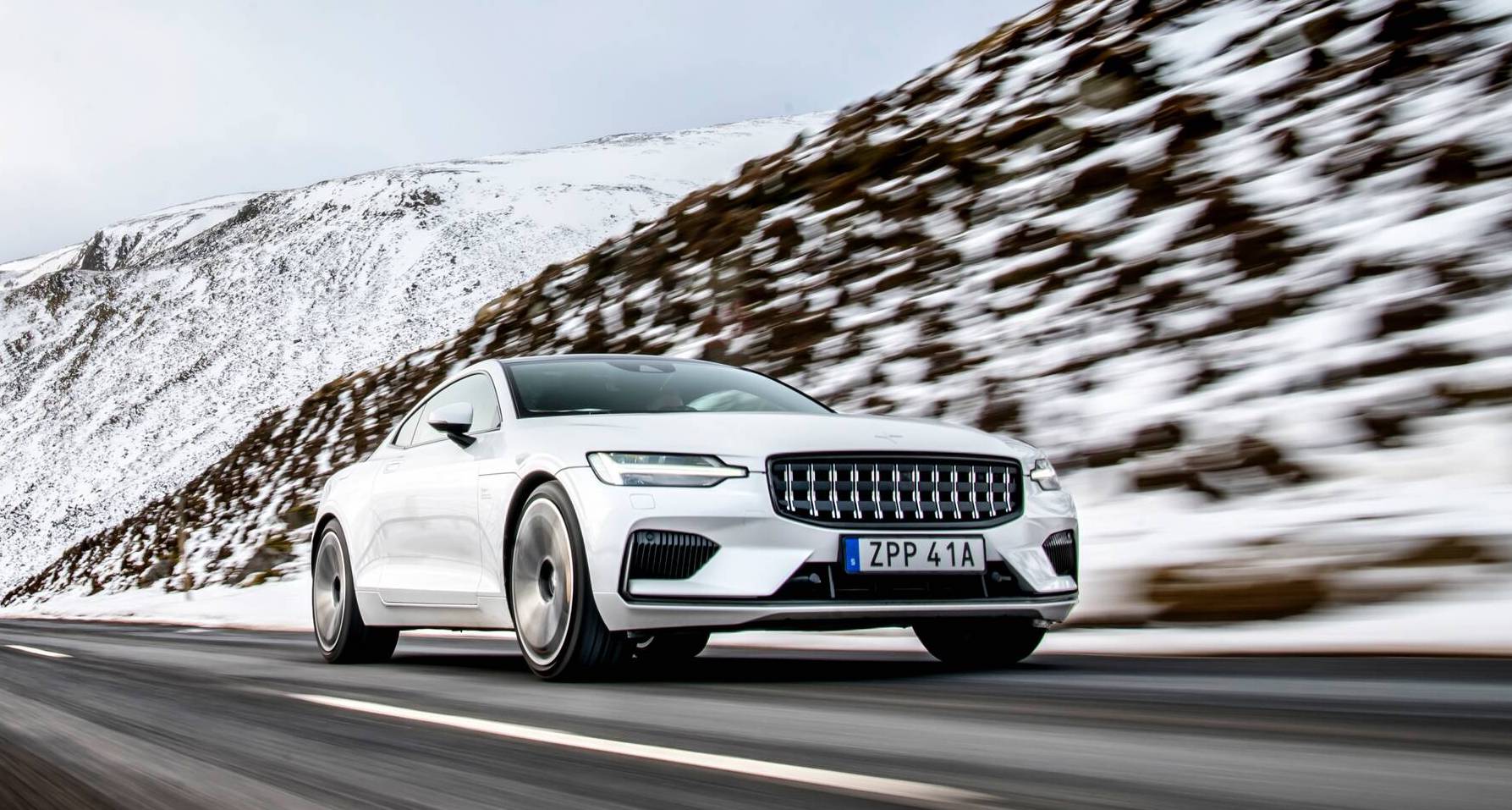 Polestar electric car exterior front driving in snow