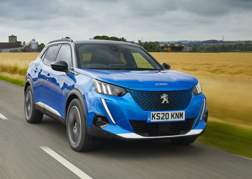 Peugeot E2008 electric car exterior front driving