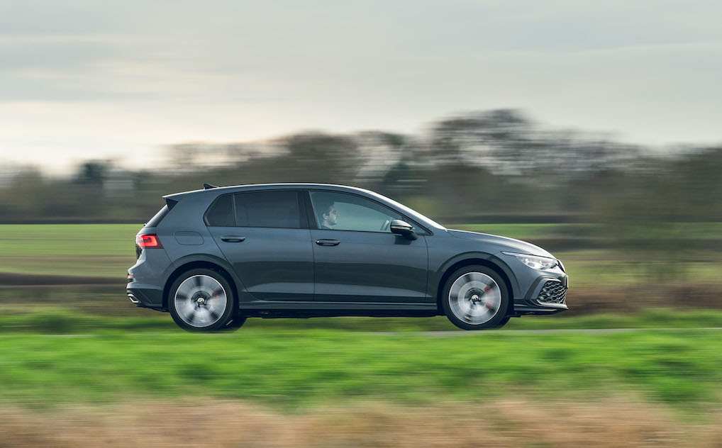 VW Golf GTE PHEV exterior side driving in country