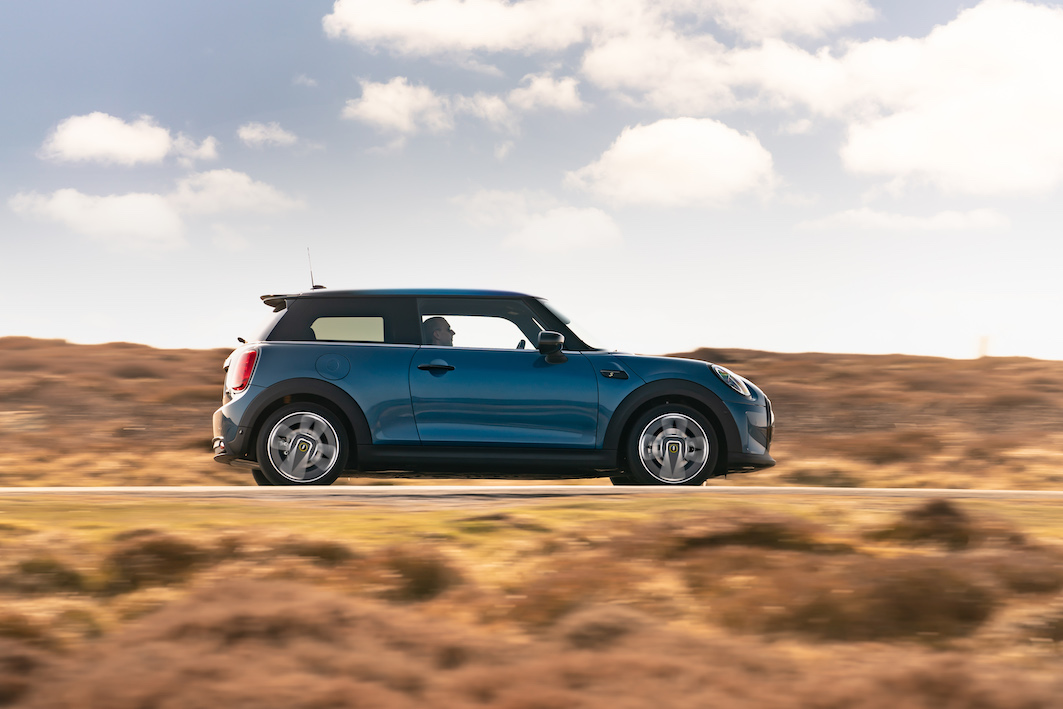 2021 MINI Electric side on action shot, blue car, in countryside