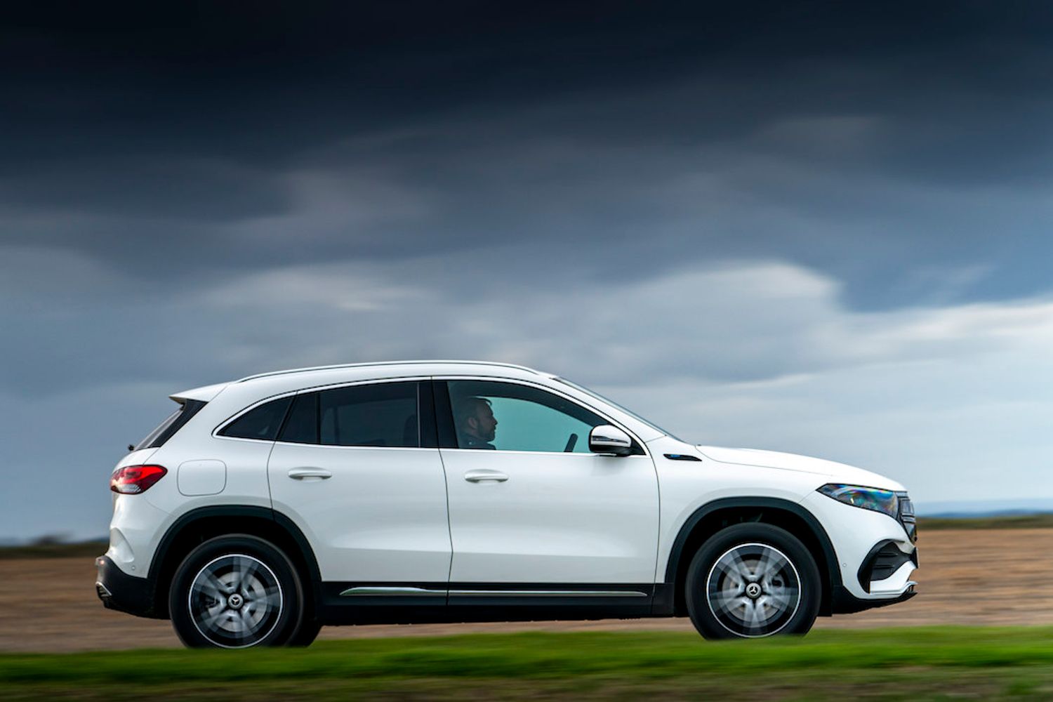 Mercedes EQA side on action shot in countryside
