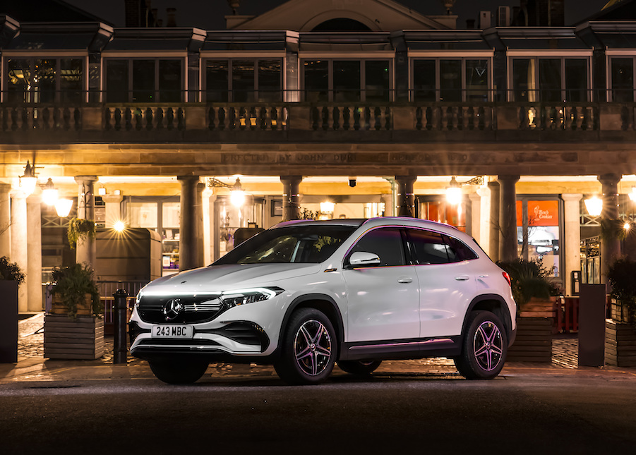 Mercedes EQA static shot, front three quarters, night shot in town