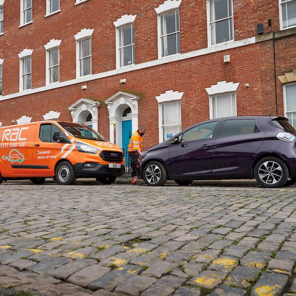 RAC van (Ford Transit) on cobbled street, patrols rescuing a Renault Zoe