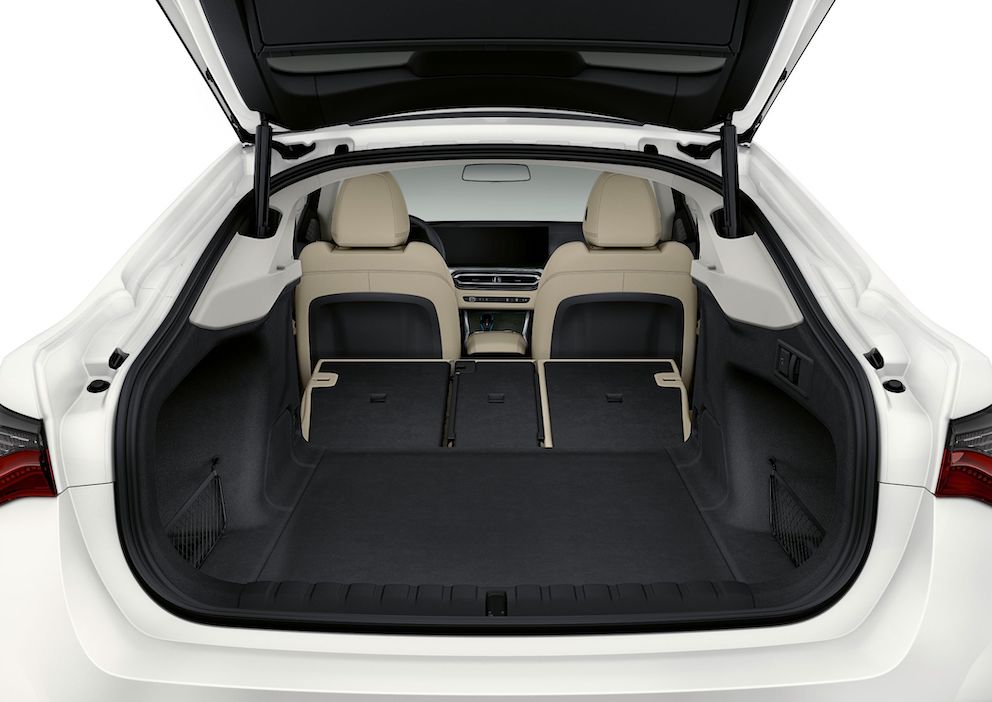 BMW i4 luggage space, seats down, black and beige interior