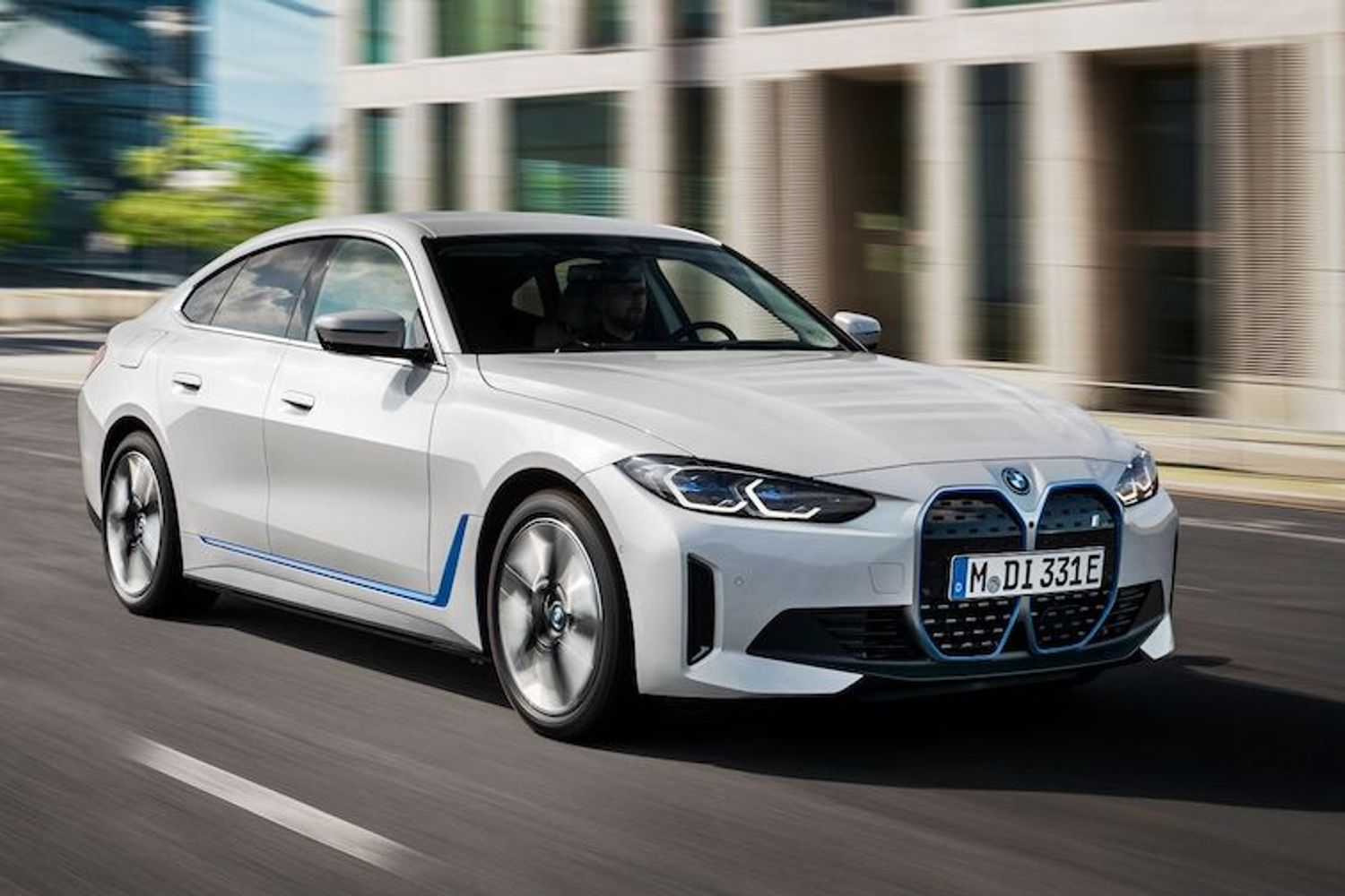 BMW i4 front action shot, white car, German registered