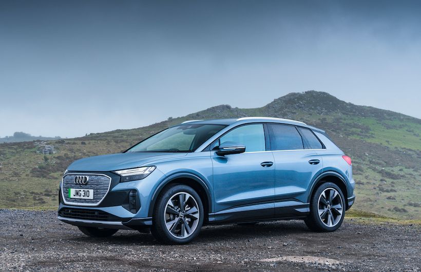 Audi Q4 e-tron front static shot, on gravel in countryside, blue/silver car, RHD, UK plates
