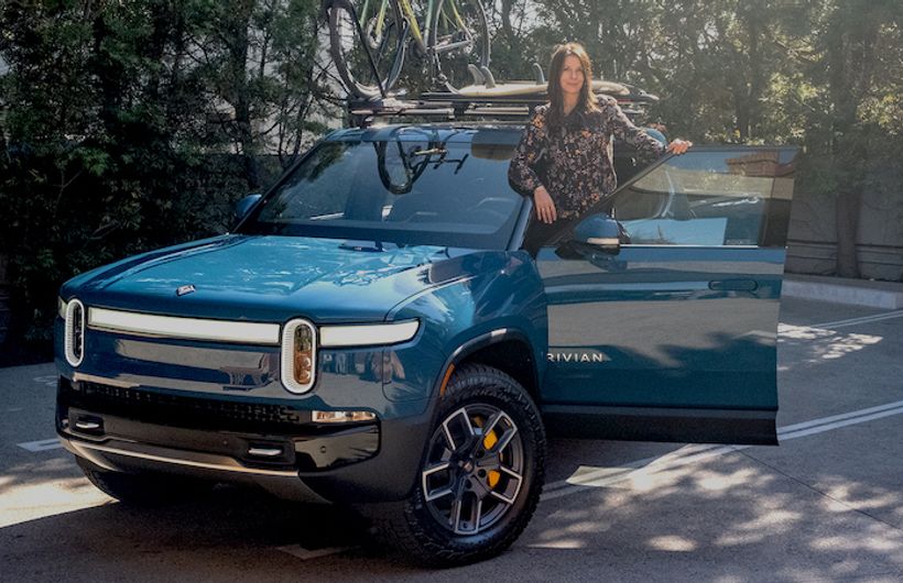 Rivian R1T in blue with Ginny Buckley