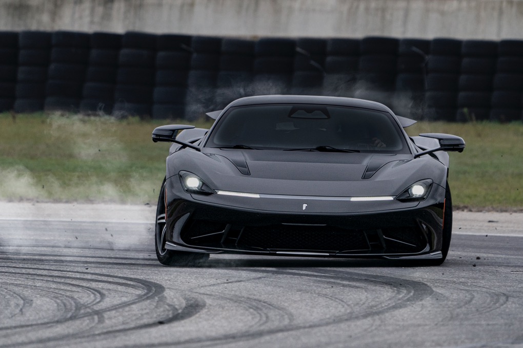 Pininfarina Battista sliding sideways on track, tyres smoking