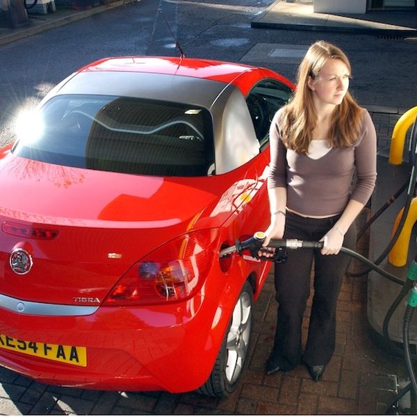 Red 2004 Vauxhall Tigra being filled with diesel