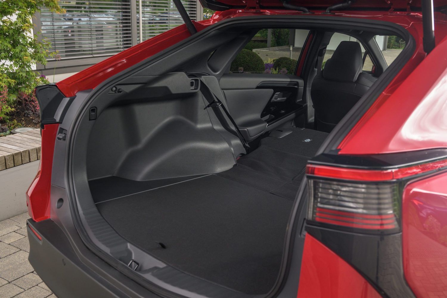 Toyota bZ4x boot shot, red car, RHD UK registration