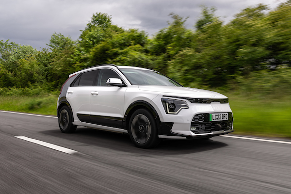 Kia Niro ev, white, action shot, front three angles